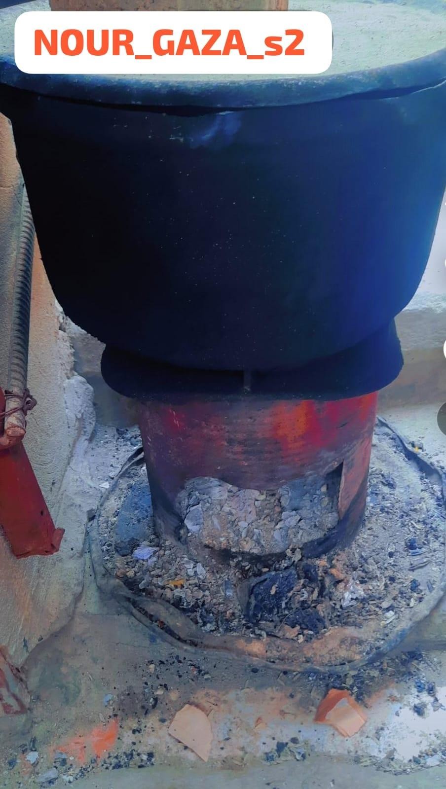 A cooking pot over the fire.